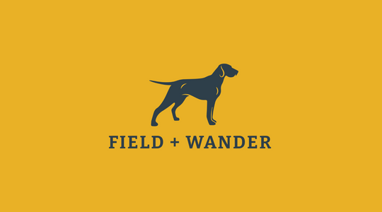 Yellow background with navy dog logo with text "Field + Wander" under it