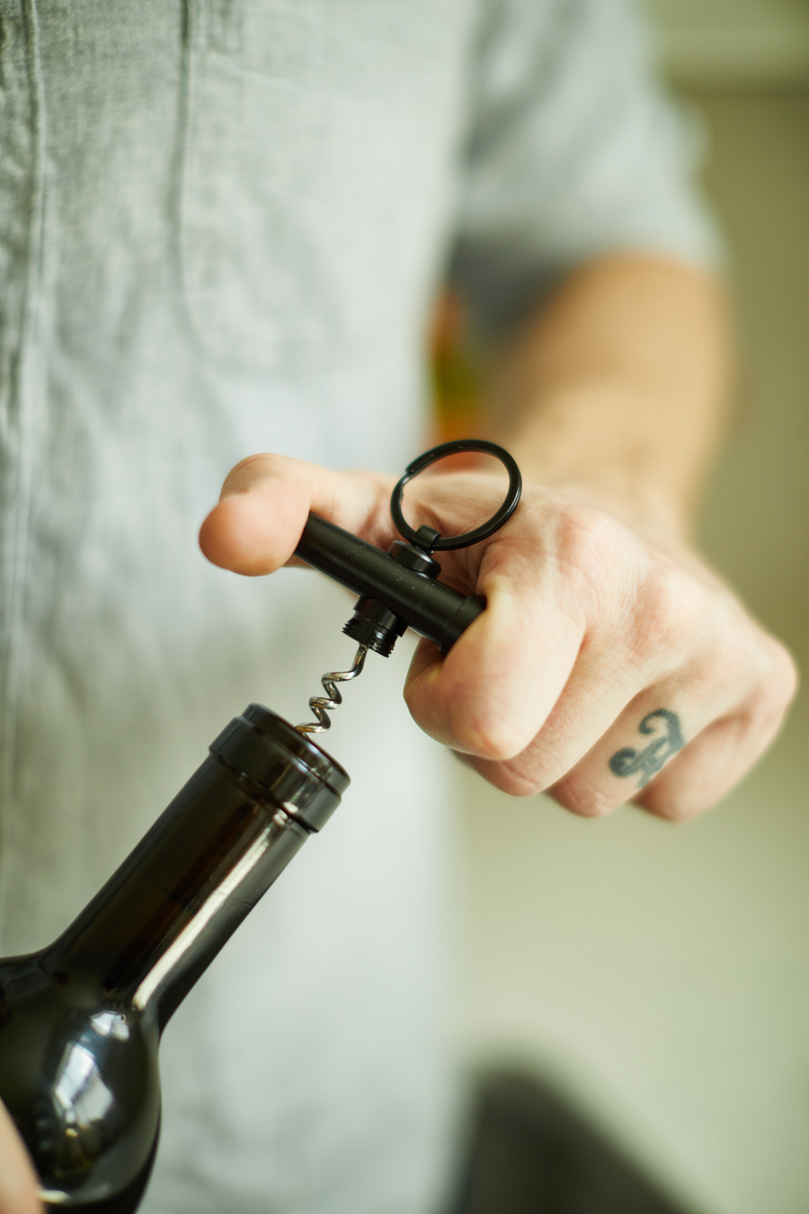 Keychain corkscrew in use.