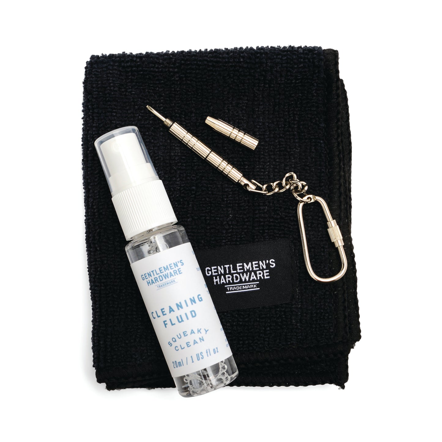The Squeaky Clean Clean & Repair Kit includes a black cloth, cleaning fluid spray, mini screwdriver, and keychain—all labeled Gentlemens Hardware.