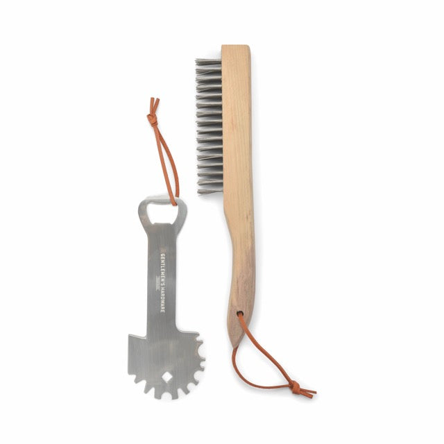 The BBQ Care Kit Grill Scraper & Wire Brush, each with a leather loop, are displayed on a white background—perfect essentials for grilling.
