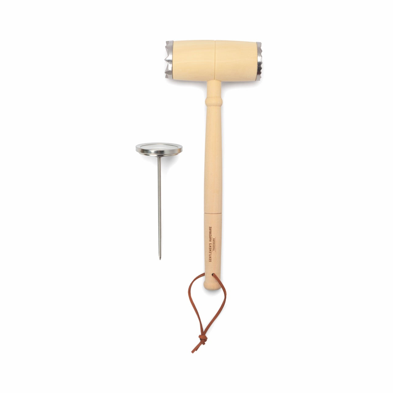 The BBQ Lovers Kit Meat Tenderizer & Thermometer includes a wooden dual-head mallet with a metal head and leather strap, plus a stainless steel meat thermometer—essential tools for every BBQ enthusiast.