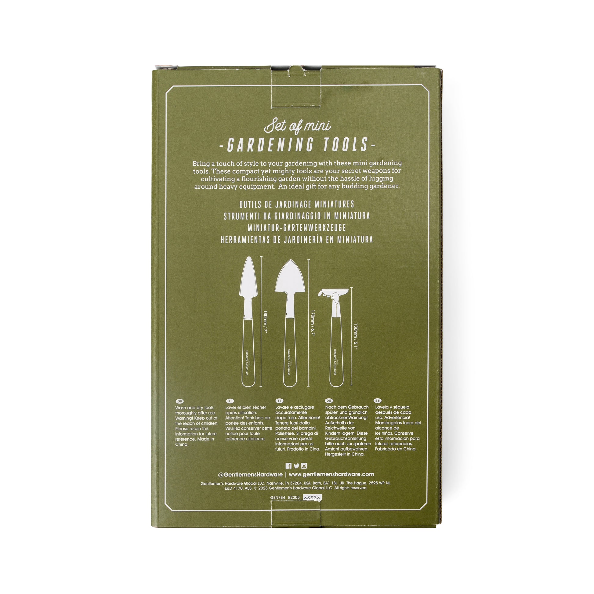 Compact and durable green box labeled Mini Garden Tools, with illustrations and descriptions of a trowel, transplanter, and cultivator on the back. Text is presented in multiple languages.