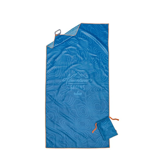 A blue rectangular outdoor blanket with an orange border, contour map design, and “The adventure begins” at the center. Comes with a matching blue pouch and pairs perfectly with the Travel Towel for all your adventures.
