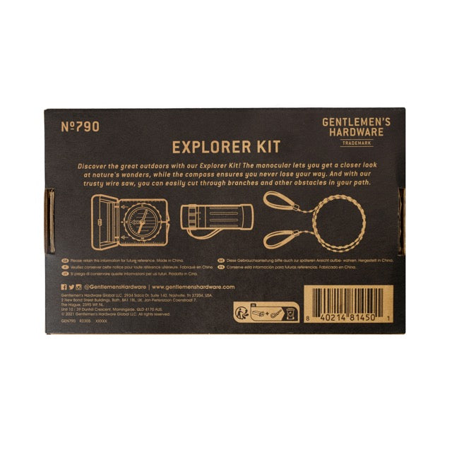 The Explorer Kit by Gentlemens Hardware comes in a brown box and includes a monocular, compass, and wire saw—essential tools for outdoor adventure and exploring new terrain.