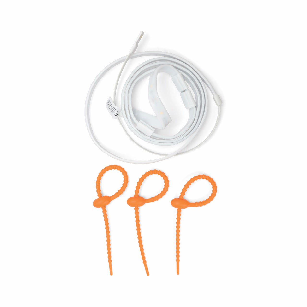 A coiled white medical tube with attached connectors is displayed above three orange adjustable plastic cable ties, resembling LED Rope Lights for campsite lighting, all placed on a plain white background.