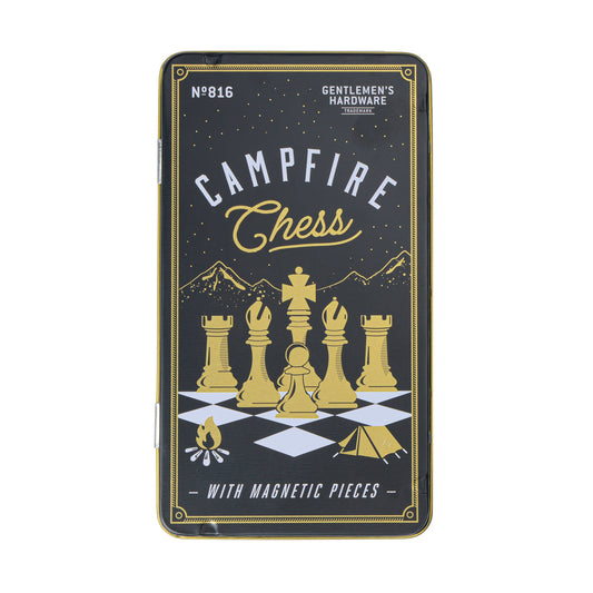 Travel Chess by Gentlemens Hardware comes in a rectangular metal tin labeled Campfire Chess, featuring gold magnetic pieces, a mountain illustration, and text emphasizing its portability for travelers.