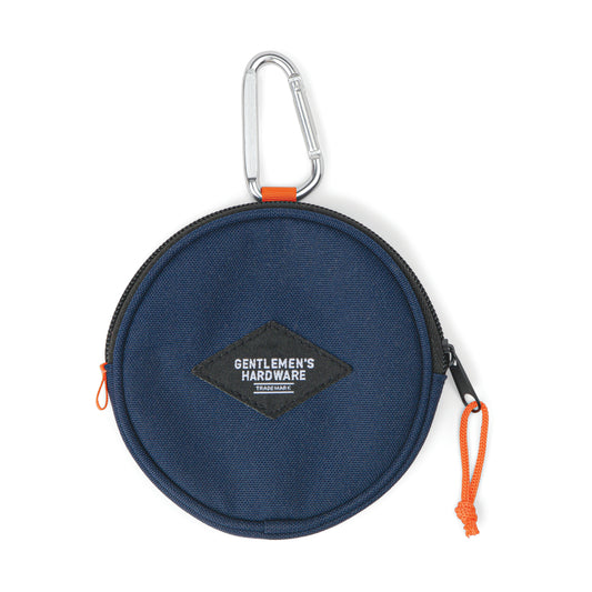 Round navy blue Utility Pouch featuring an orange zipper pull, black patch label, sturdy carabiner, and crafted from rugged Cordura fabric—perfect for reliable use on the go.