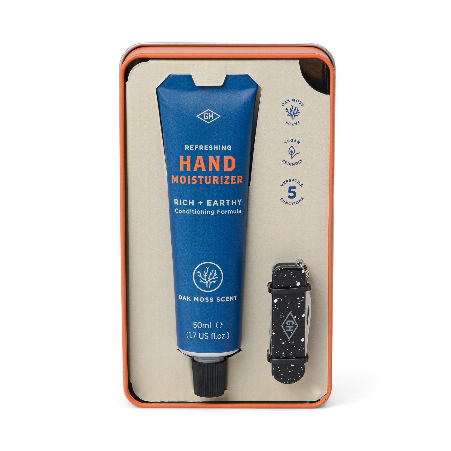 The In Good Hands Kit includes Oak Moss Scent Hand Moisturizer in a blue tube and a black patterned Manicure Multi-Tool, all packaged in a stylish tin gift set.