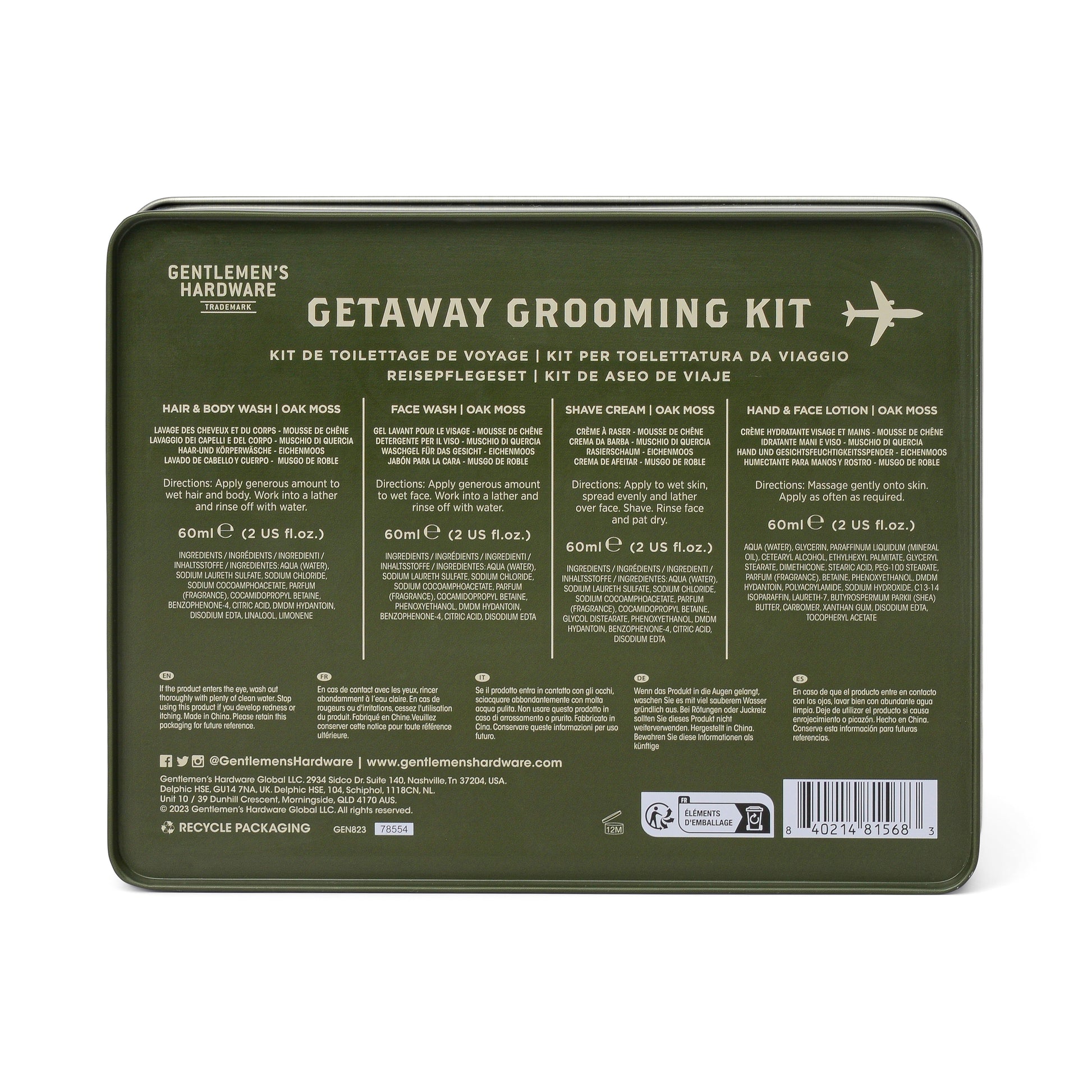 The Getaway Grooming Kit comes in a green tin and includes vegan hair & body wash, face wash, shave cream, and hand & face lotion with multilingual descriptions—ideal as a travel accessory.