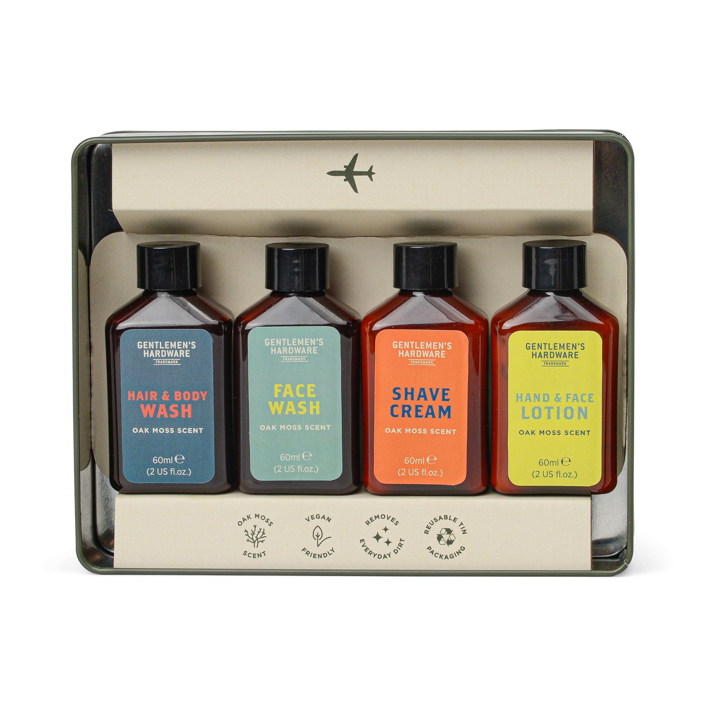 The Getaway Grooming Kit includes four vegan bottles—Hair & Body Wash, Face Wash, Shave Cream, and Hand & Face Lotion—organized in a sleek metal tin for travel.
