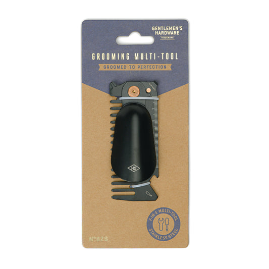 The Grooming Multi-Tool is a compact device featuring various stainless steel grooming implements, presented on a Groomed to Perfection cardboard backing.