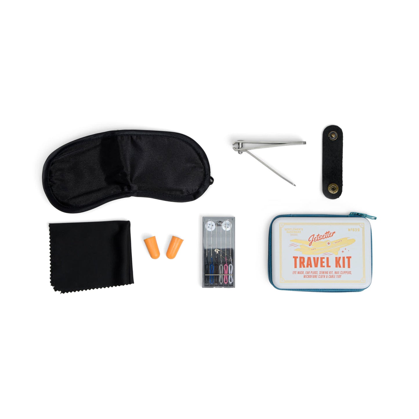 The Jet Setter Kit is a pocket-sized travel set with an eye mask, nail clipper, fabric pouch, earplugs, sewing kit, and cleaning cloth—perfect for on-the-go convenience and neatly arranged on a white background.