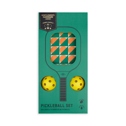 The Pickle Ball Set includes two yellow balls and two orange-and-green patterned paddles in green packaging, labeled Gentlemen’s Hardware Games Supply—perfect for competitive or casual games wherever you are.