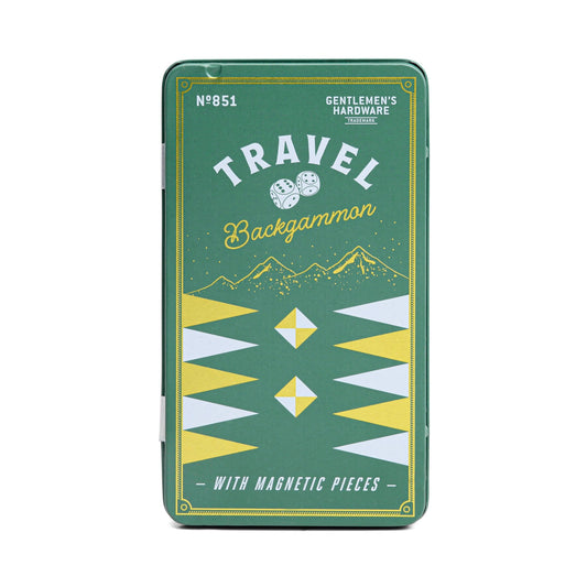 The Travel Backgammon is a green rectangular tin with a magnetic playing surface, featuring geometric designs and a mountain illustration on the lid.
