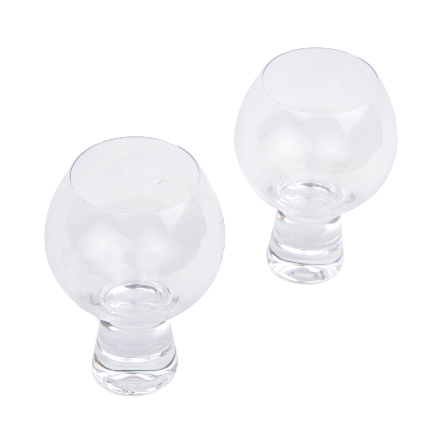 The Gin Glass - Set Of 2 features two empty, clear goblet-shaped glasses placed on a white background, photographed from above at an appealing angle.