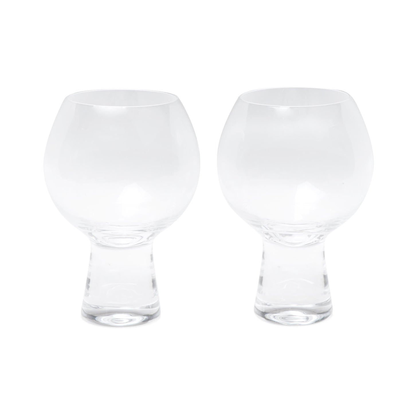 The Gin Glass - Set Of 2 features clear, goblet-shaped glasses with short, thick stems, displayed side by side on a white background for an enchanting look.