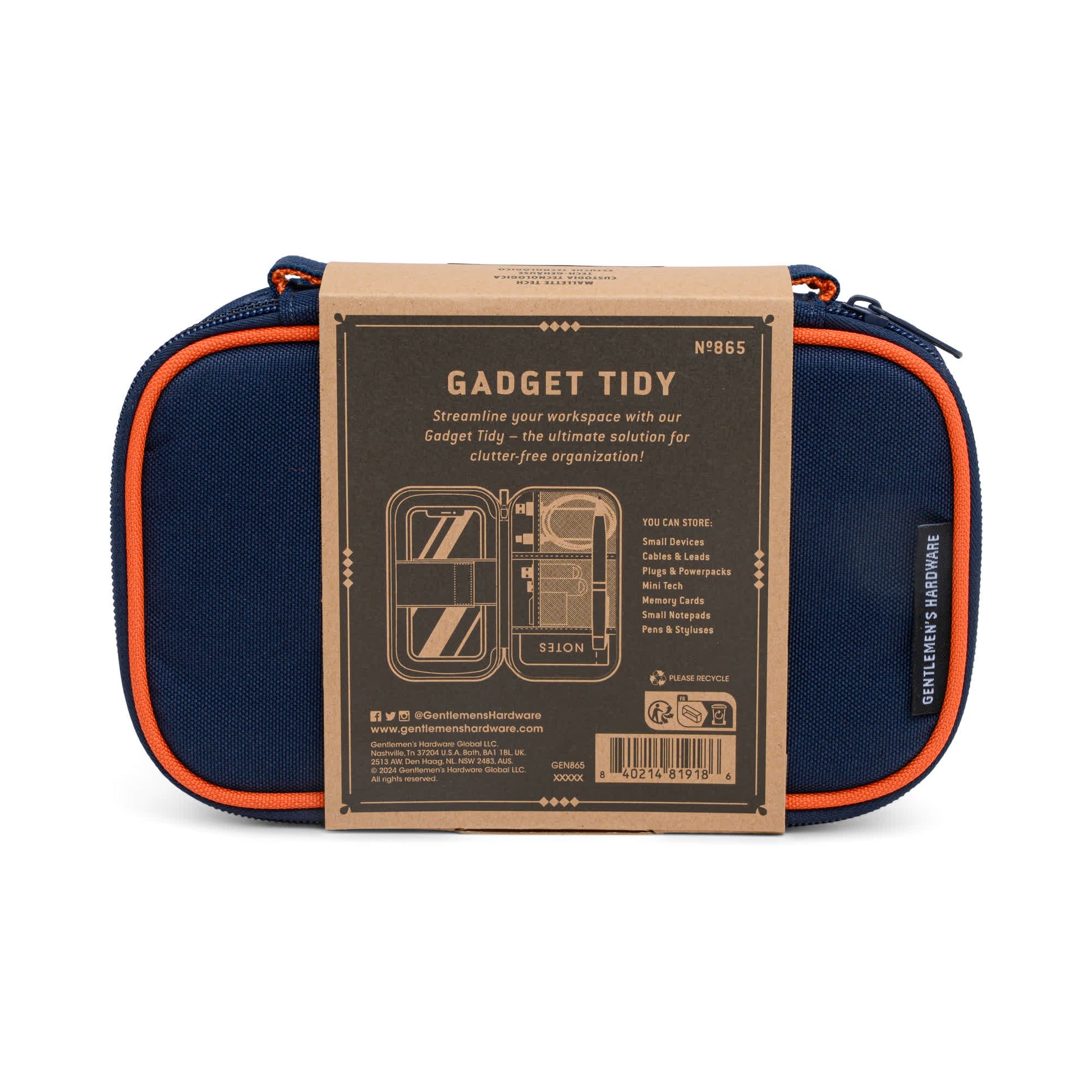 The Tech Tidy Case in navy blue with orange zippers and a brown label keeps cables, pens, and accessories organized—making it the perfect solution for a clutter-free workspace.