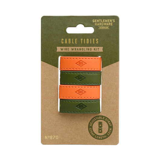 A set of three vegan leather Cable Tidys—two orange, one green—on branded cardboard backing, perfect for stylish cable management.