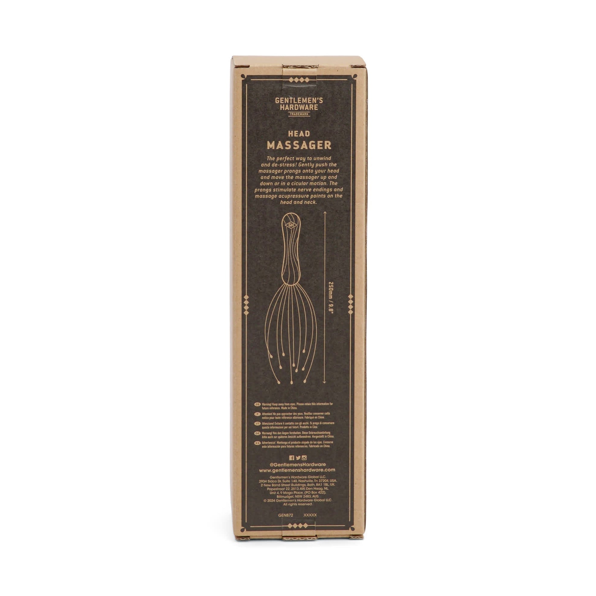 A rectangular brown Head Massager box with gold text and instructions, featuring a front diagram showing how the tool targets acupressure points and nerve endings for relaxation.
