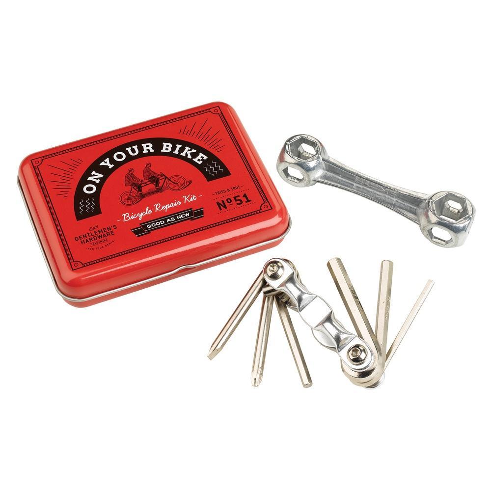 The Bicycle Repair Kit comes in a vintage-style tin labeled On Your Bike and includes a metal wrench, tire levers, and a multi-tool with screwdrivers and hex keys.