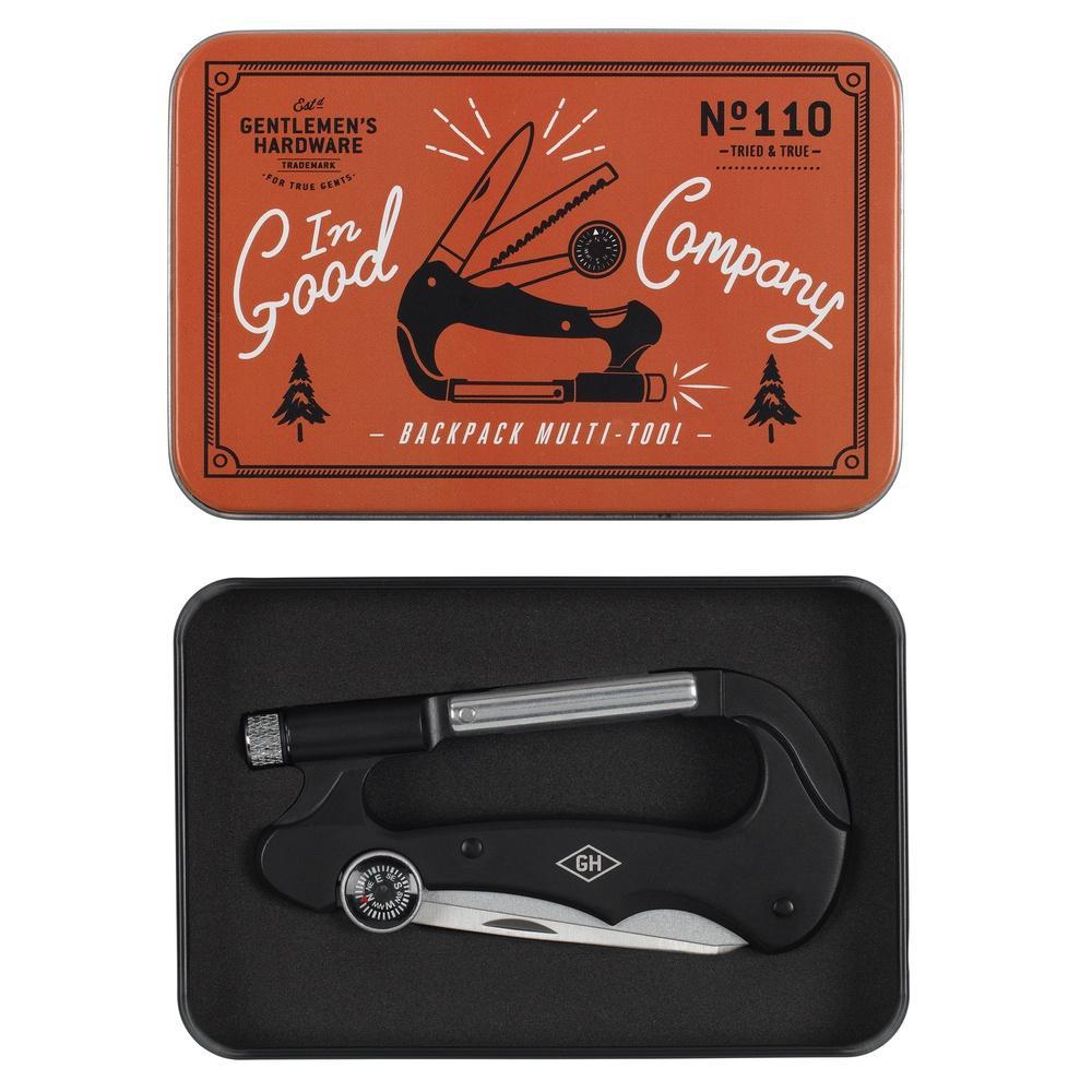The Backpack Multi-Tool comes in a metal tin featuring tool art on the lid and contains a compact stainless steel multitool—an essential accessory for survival and adventure.