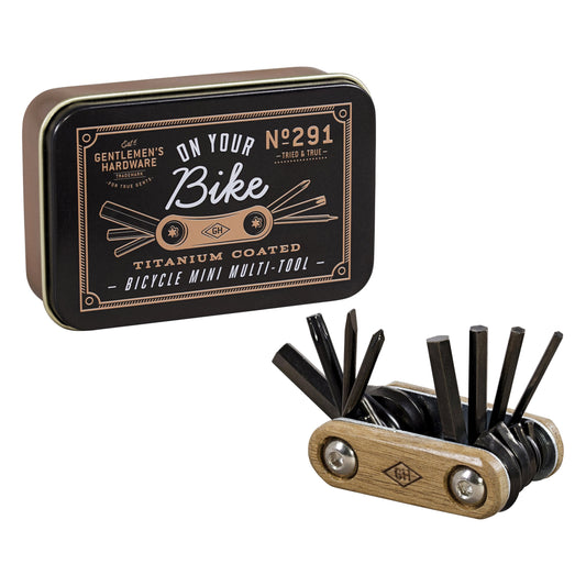 A Bike Multi-Tool with titanium coated steel tools is shown beside a metal storage tin labeled On Your Bike Bicycle Mini Multi-Tool.