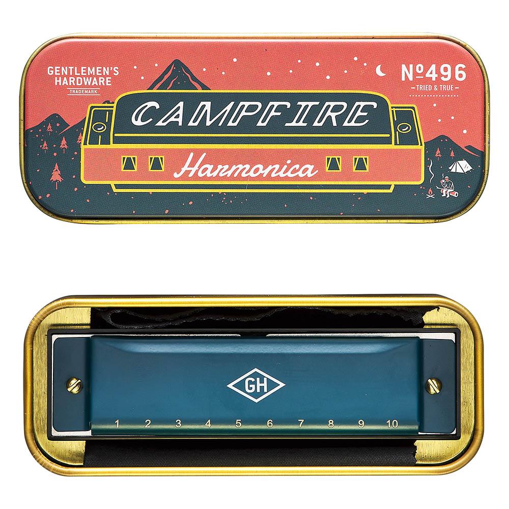 A tin case labeled Campfire Harmonica with a mountain design opens to reveal a blue harmonica numbered 1–10 and marked GH—making it an ideal gift for any music lover.