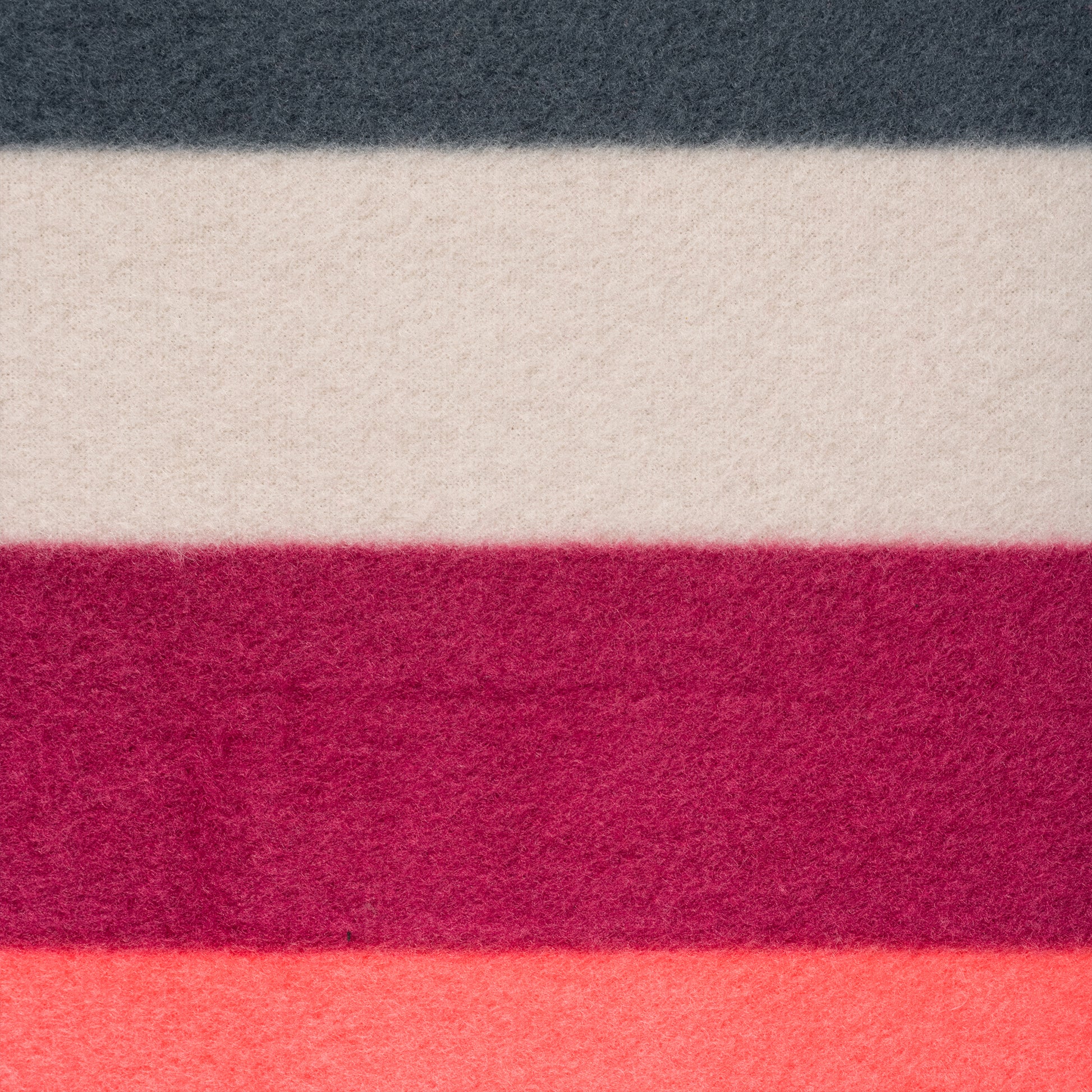 The Camping Blanket is a lightweight woolen fabric featuring horizontal stripes in dark gray, off-white, maroon, deep red, and coral pink—ideal for outdoor adventures.