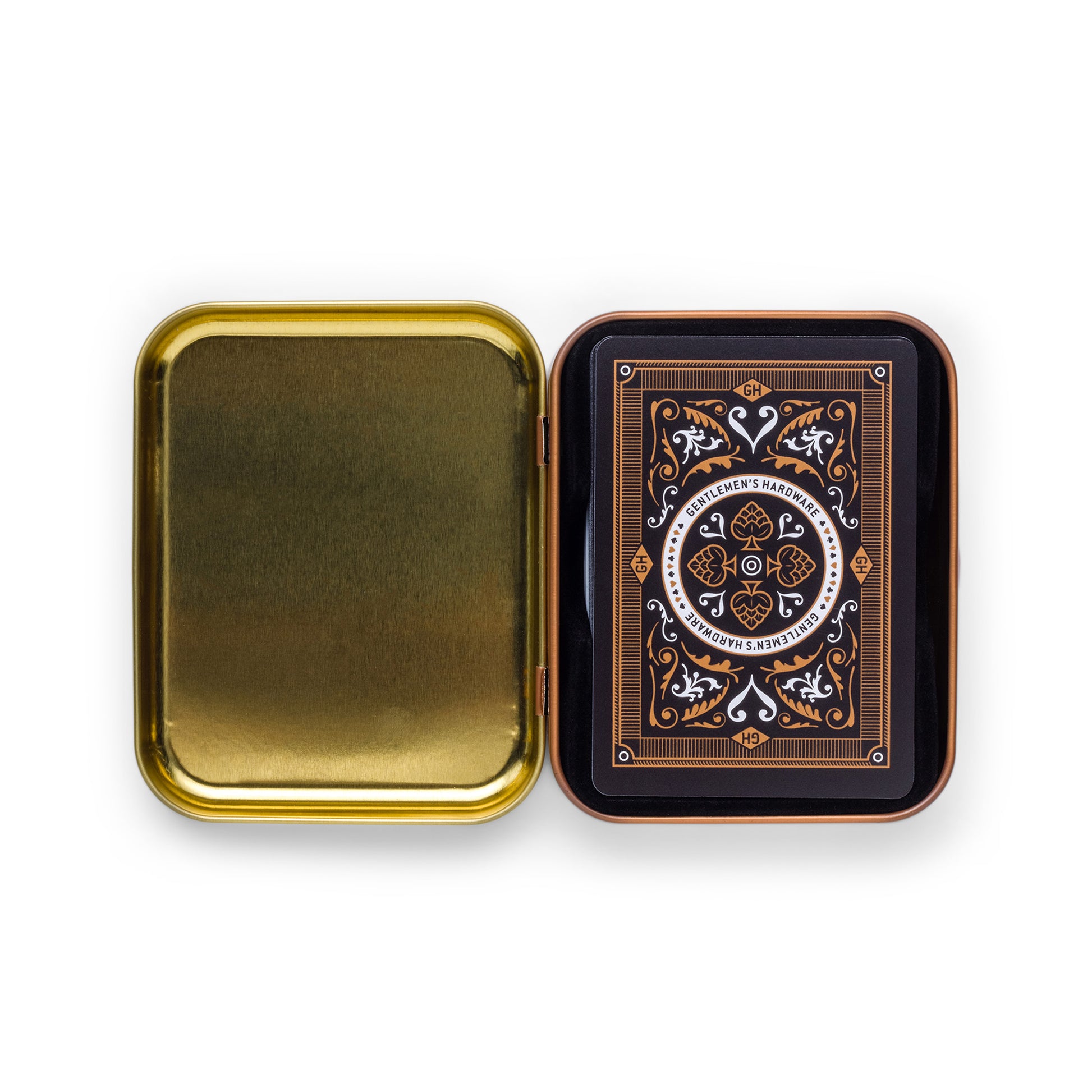 An open rectangular gold metal tin travel case reveals the Beer Playing Cards inside, with the top card showcasing an ornate design in black, orange, and white.