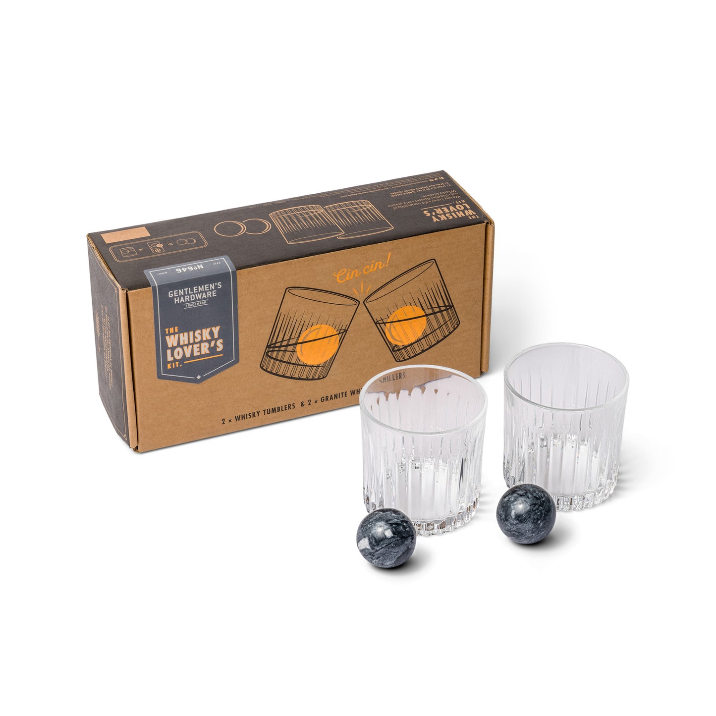 The Whiskey Tumbler Glasses & Ice Stones Set includes a box, two clear whiskey tumblers, and two round black whiskey stones, all elegantly arranged on a white background—perfect for whisky lovers.
