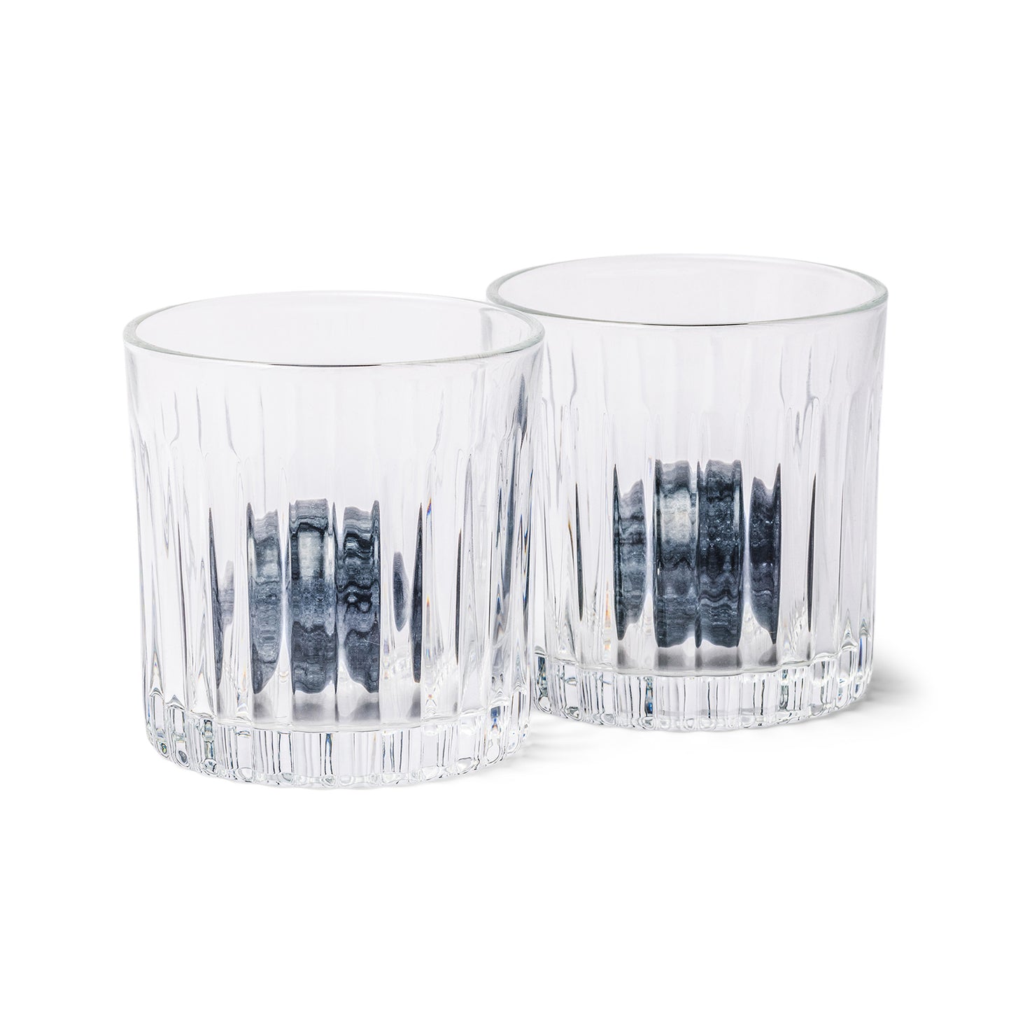 Two clear, textured whiskey tumblers from the Whiskey Tumbler Glasses & Ice Stones Set sit side by side on a white background—an ideal addition to any stylish home bar gift set.