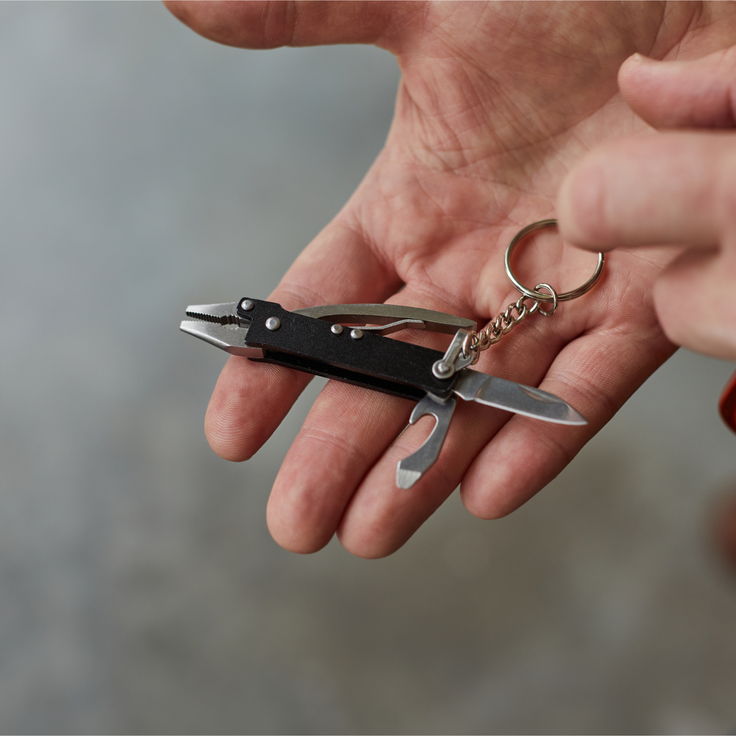 Mini tool pliers in palm of hand