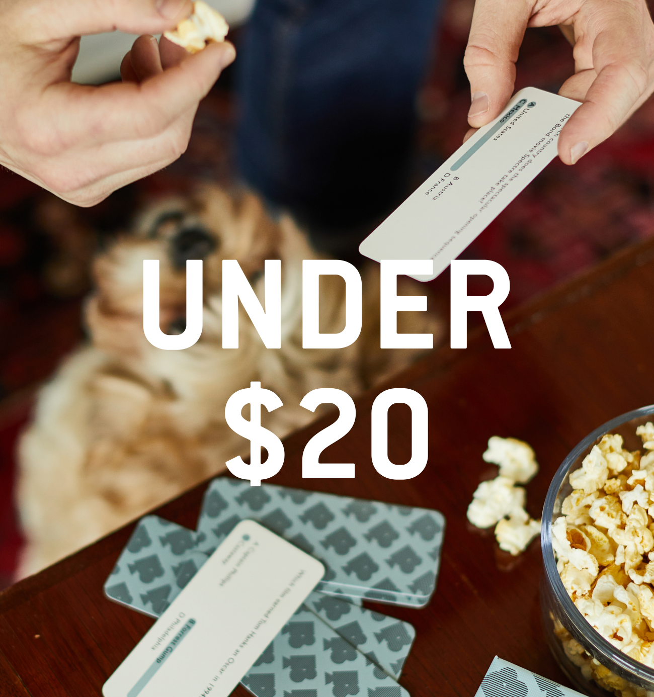 Cards and coasters on brown wood table text reads Under $20