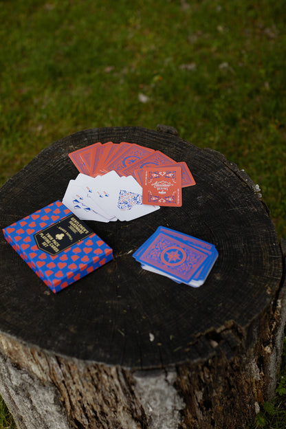 Gentlemen's Hardware Twin Pack Playing Cards fanned on a log with box