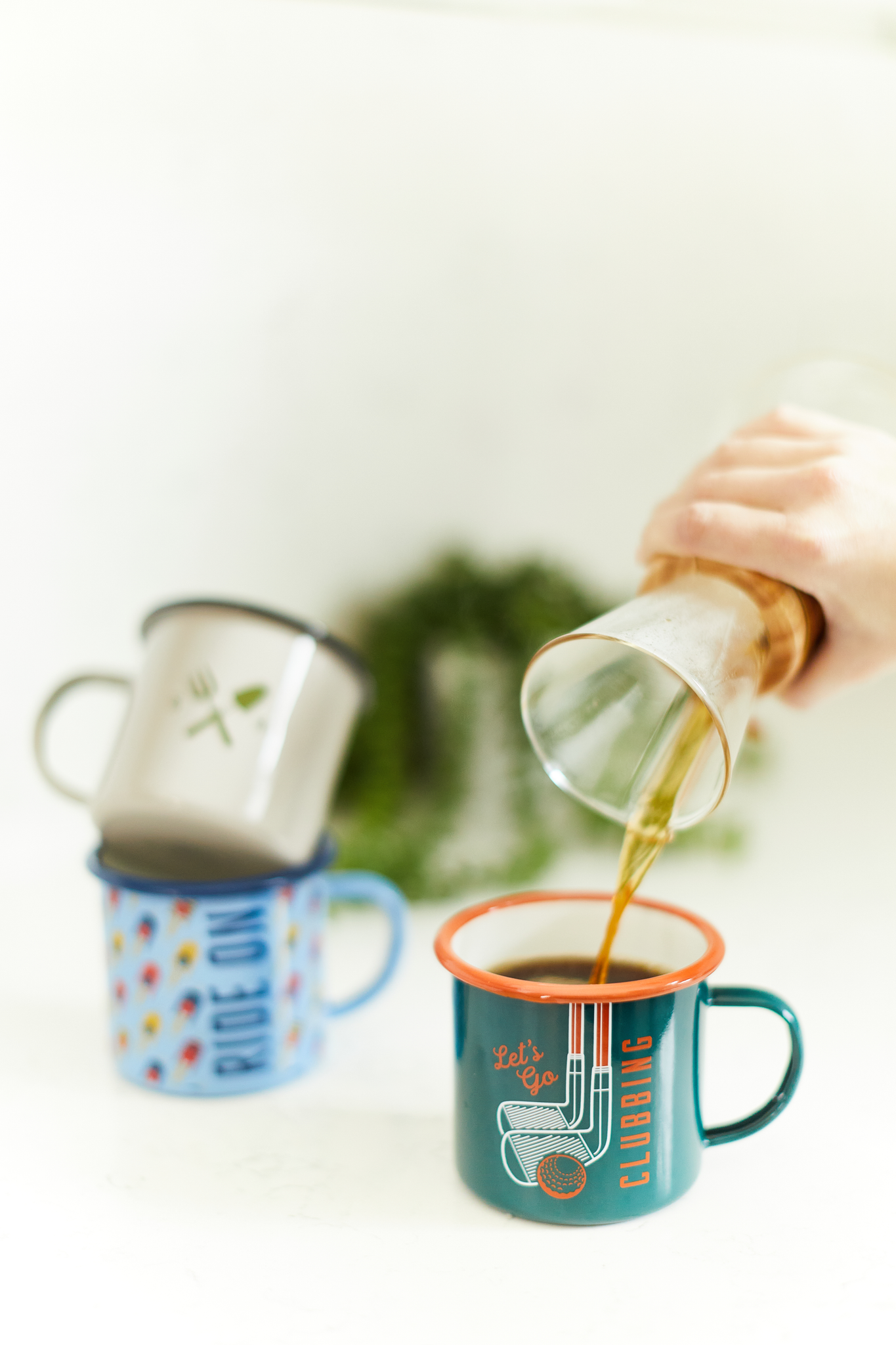 Three enamel mugs. 