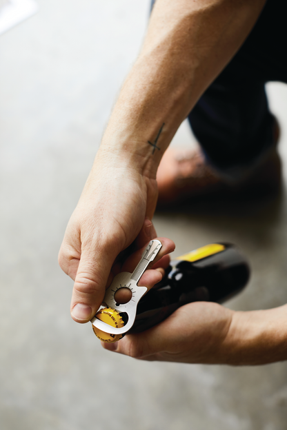 Guitar bottle opener in use.