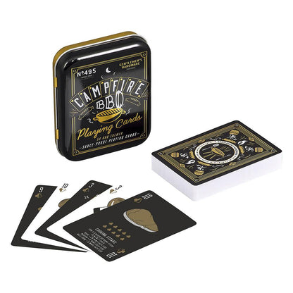 A tin labeled BBQ Playing Cards is shown with a deck of waterproof cards, some spread out to display BBQ-themed graphics and icons on a black background—ideal for outdoor activities.