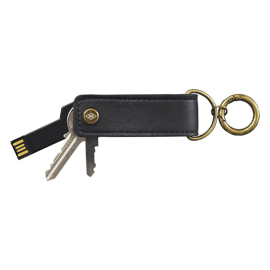 black leather usb and key tidy keychain with gold ring on white background