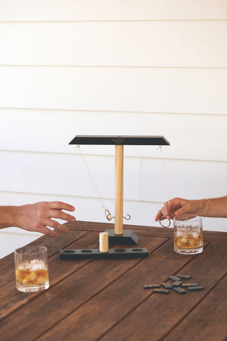 Ring Swing Game on a picnic table with two people playing