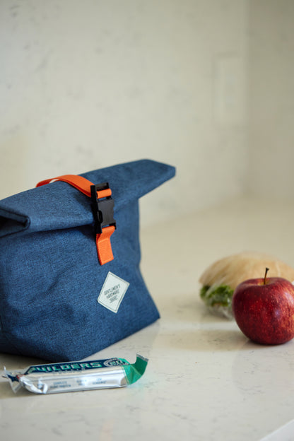 Roll-Top Lunch Bag on counter with food items