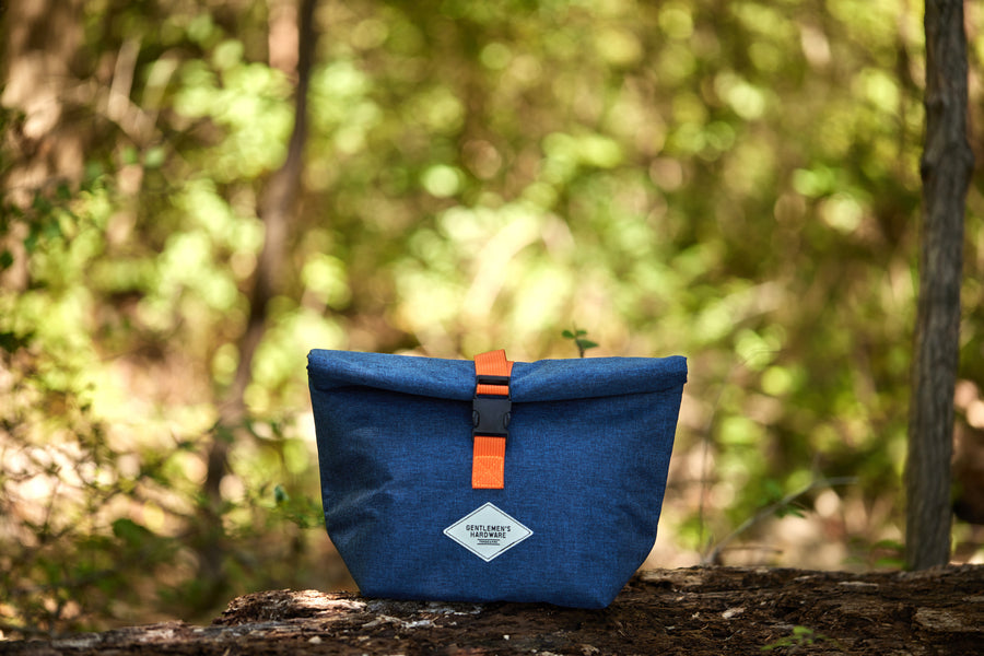 Roll-Top Lunch Bag on a log in the forest